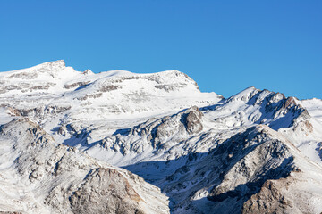Summits of Sierra Nevada in winter and with snow, landscape of the peaks and edges of the mountain range with the Veleta as the main peak.
