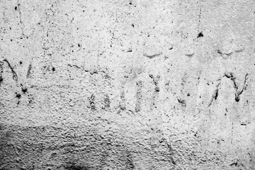 Texture of a concrete wall with cracks and scratches which can be used as a background