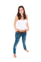 Summer portrait of a happy young woman wearing sunglasses, blue jeans and white top, isolated on white studio background