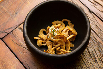 Delicious appetizer of fried pork rinds.