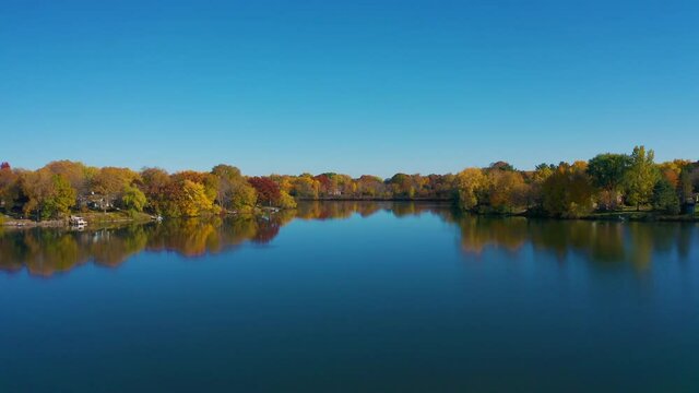 Drone over Glassy Lake in Autumn