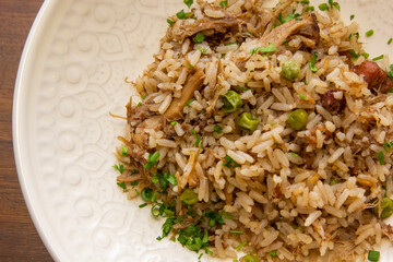 Duck rice with peas and spices