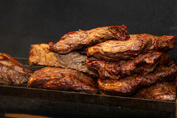 Various steak on the grill with ancho meat. Brazilian barbecue.