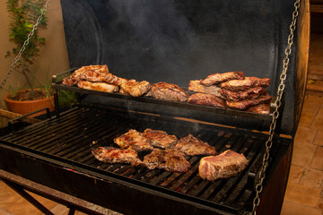 Various steak on the grill with ancho meat. Brazilian barbecue.