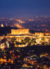 Fototapeta na wymiar Vertical view of illuminated Acropolis of Athens. Greece at night background.