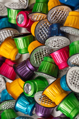 Colorful used espresso coffee capsules background.