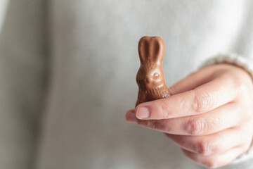 Woman hands holding chocolate Easter bunny