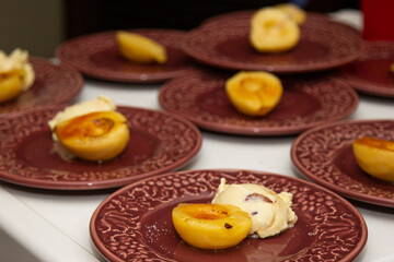 Pear with caramelized syrup served with ice cream.