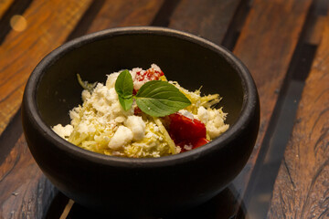 Spaghetti from pupunha with pesto and goat cheese.