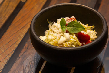 Spaghetti from pupunha with pesto and goat cheese.