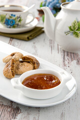 Delicious Fig Jam for Breakfast on white wooden table.