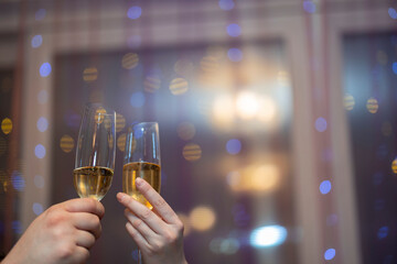 Close up view of man and women holding champagne glass. Love. Holiday.