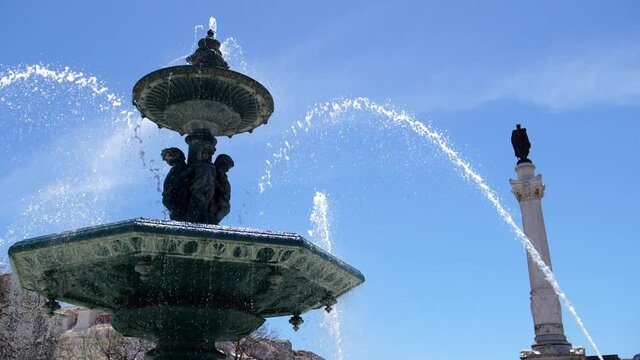 fountain in Rossio square dowtown Lisbon, Portugal slow motion