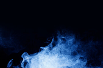 Abstract blue smoke moves on black background. Swirling smoke.