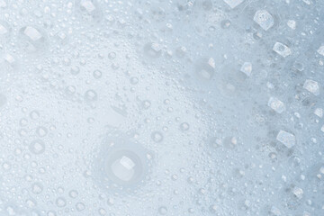 Foam bubble from soap or shampoo for washing isolated on white background from above