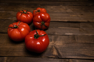 tomatoes on wooden background