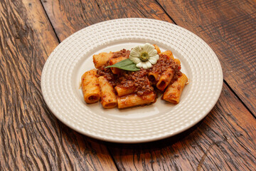 Rigatoni pasta with lamb sauce and ragout.