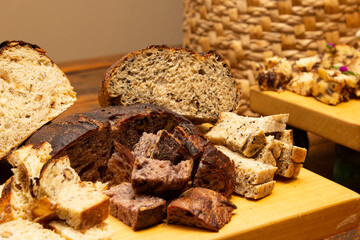 Delicious slices of homemade bread on the wooden board.