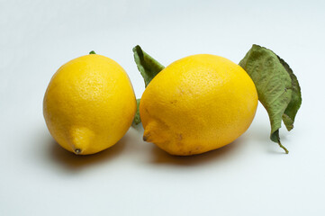 lemon fruits with leaves on white background
