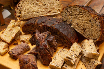 Delicious slices of homemade bread on the wooden board.