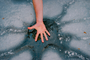 hands on the ice water
