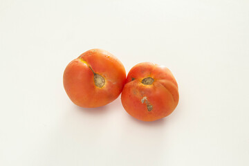 Organic tomatoes on white background