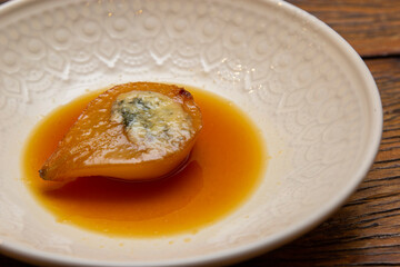 Dessert Pear Brulee stuffed with Gorgonzola cheese