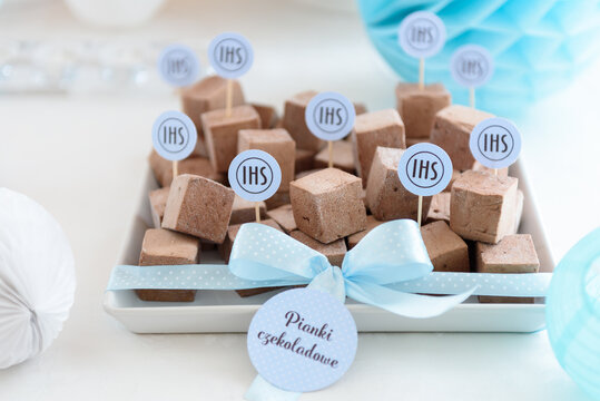 Tasty homemade chocolate marshmallows on a beautiful candy bar at the first communion party