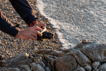Photographer doing a report on the beach