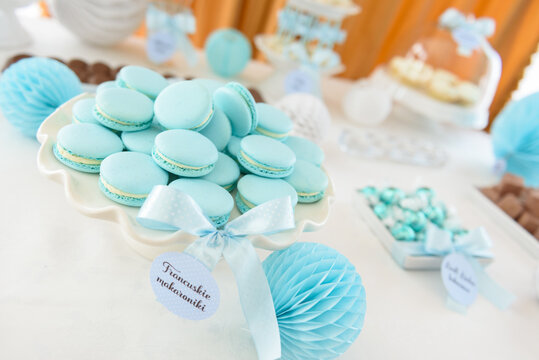 Tasty french macarons on a beautiful candy bar at the family party