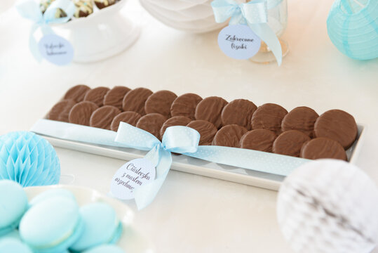 Tasty cookies with peanut butter in a chocolate glaze on a candy bar at the party