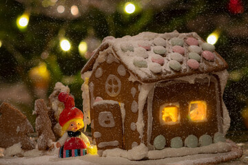 snowy gingerbread house with christmas tree