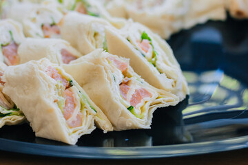 Salted fish appetizer. Seafood wrapped in a flat cake.