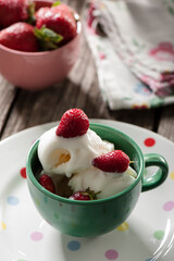 Fresh strawberries with homemade milk ice cream in bowl