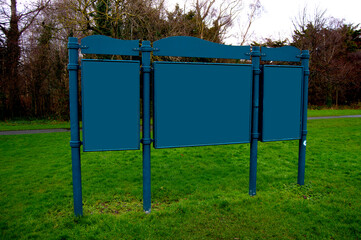 Park information sign, blue or teal colour. 