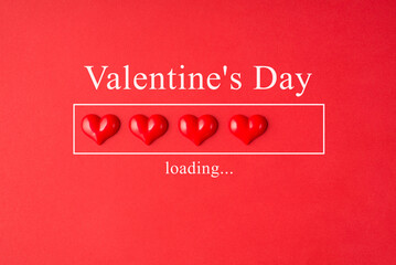 Valentines day loading concept. Close up layout view photo of red bright color hearts lying in a line with inscription isolated bright vivid background