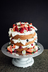 Cake with strawberries on dark background
