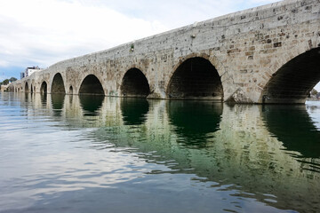 Fototapeta na wymiar Stone Bridge (Taş Köprü) over Seyhan River in Adana City - Adana, Turkey