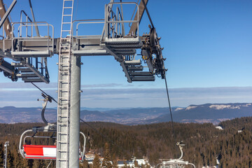 Modern mountain ski resort.- Skiers, elevator, snow.-Escape from reality