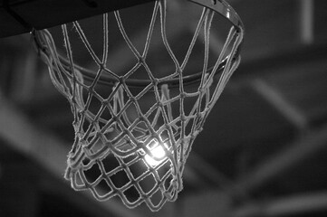 Fototapeta na wymiar Basketball hoop hanging in an indoor basketball court