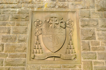Carved Decorative Stone Plaque on Old Stone Wall 