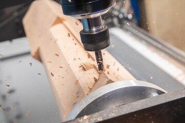 milling machine with Computer numerical control processes wood blank at high speed