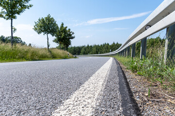 Fototapeta na wymiar Empty winding road, with guardrail in Saxony, Germany