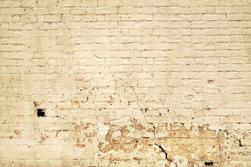 Yellow Grunge Peeling Wall. Old Damaged Brick Wall Broken Background. Block Material With Paint Over War Brickwork. Block Mortar Texture.