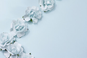 Flowers composition. Frame made of blue flowers on light background. Flat lay, top view, copy space
