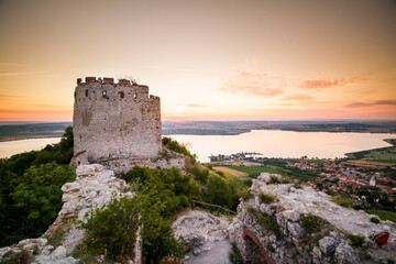 Fototapeta na wymiar castle ruins and lake during sunrise