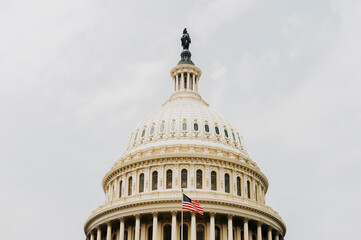 Fototapeta na wymiar American flag on the background of the Capitol