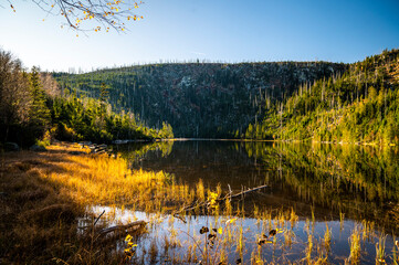 old peat lake under mountain