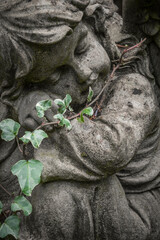 statue of an angel on an old grave
