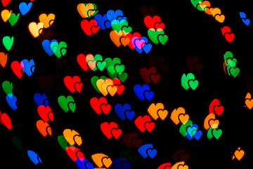 Colorful abstract heart bokeh background lights. Valentines day texture pattern. Romantic background